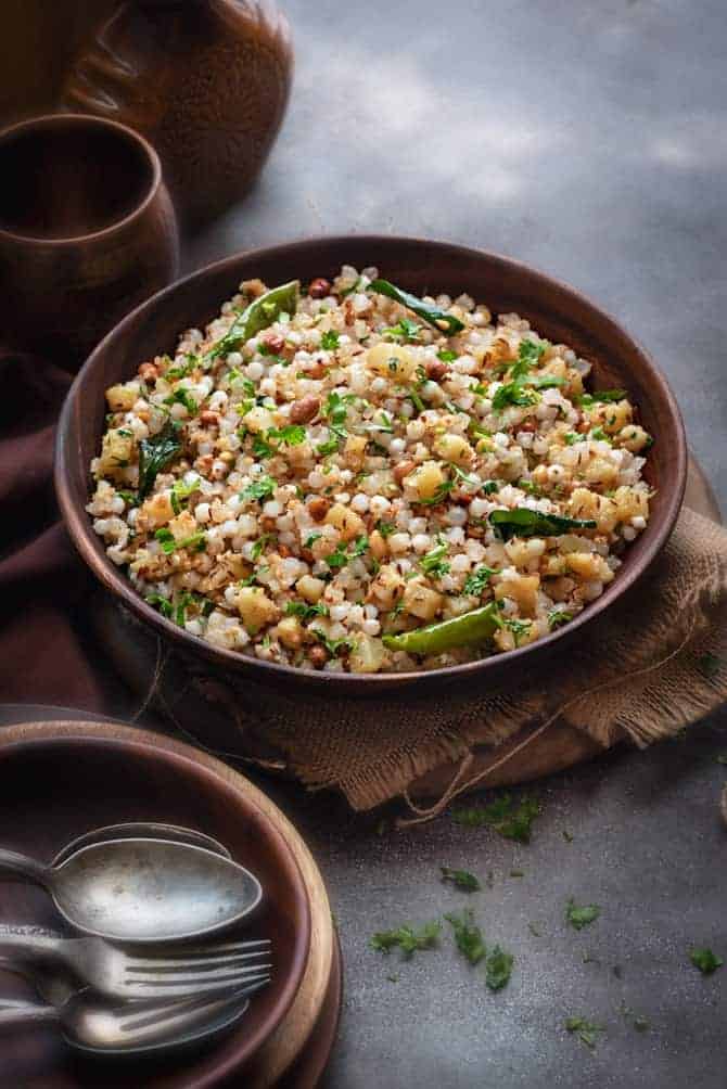 Spicy Sabudana Khichdi served in a large wooden bowl.