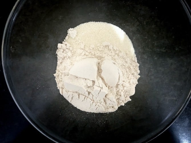 Whole wheat flour (atta) and semolina (Suji) in a large bowl