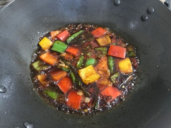 Corn flour slurry added in a wok.