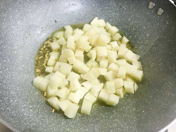cubed potatoes added in pan