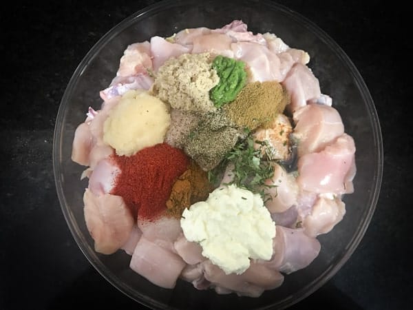 Yogurt and all the spices added in large bowl with chicken