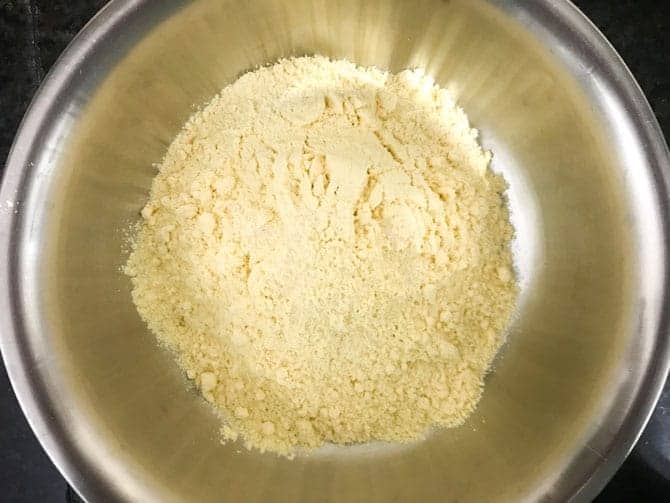 Makki ka atta or corn meal and salt added in a bowl