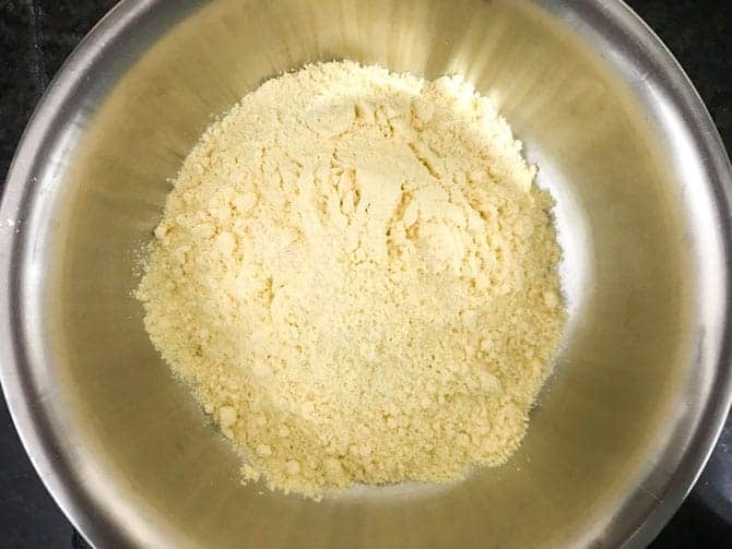 Makki ka atta or corn meal and salt added in a bowl