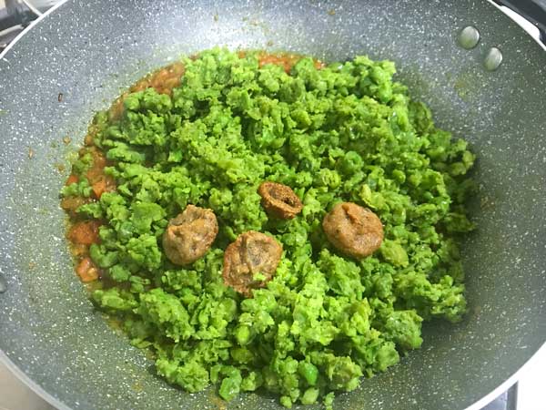 mashed green peas, salt and vadi added in pan