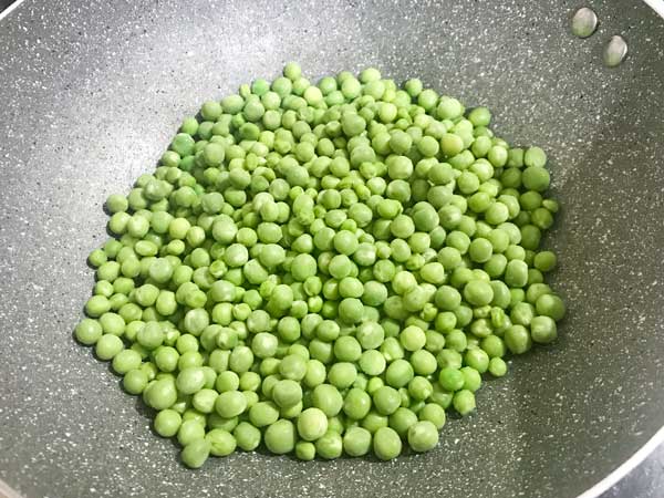 Green peas added in pan with hot ghee