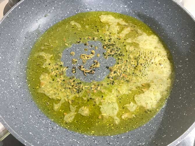 Fenugreek seeds, mustard seeds, nigella seeds, fennel seeds, cumin seeds added in pan in hot oil