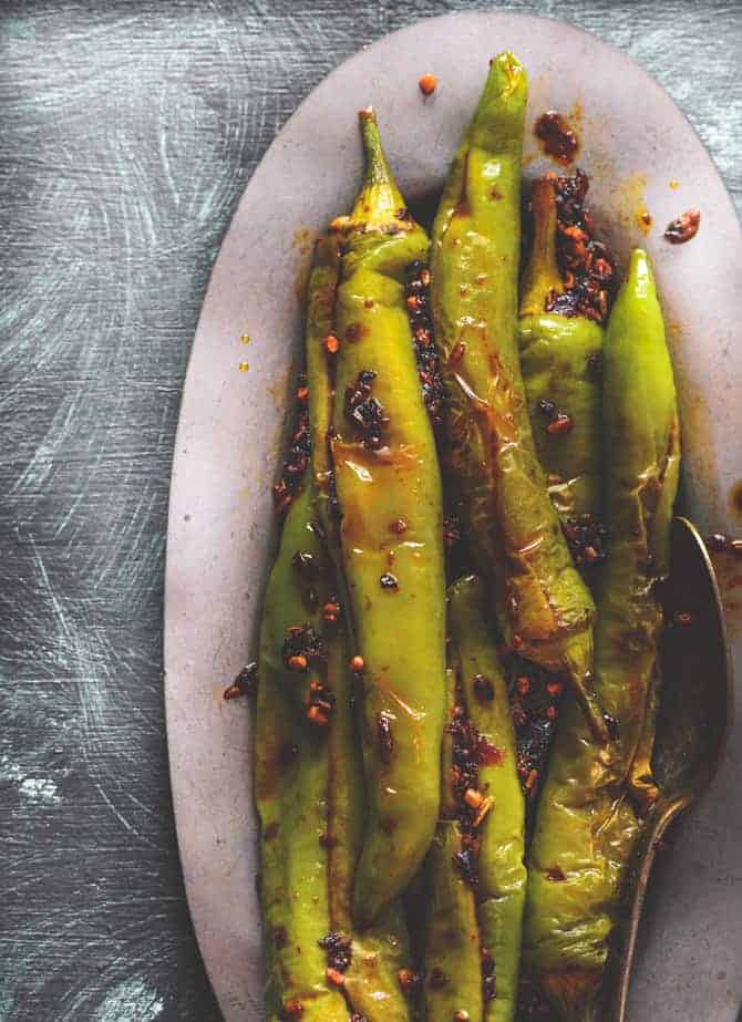 Close-up overhead shot of bharwa mirchi fry served on oval plate.