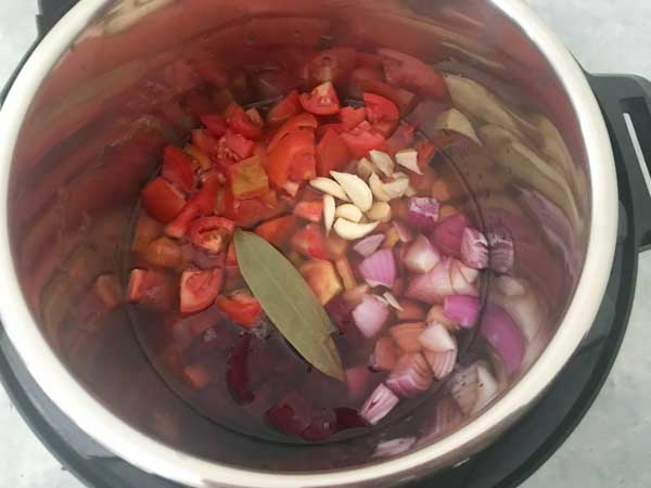 Tomato, beets, ginger, garlic, bay leaf, onion, salt and stock added in Instant Pot