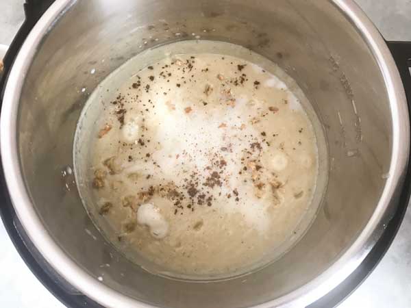 Milk, nutmeg powder and chopped walnuts added in the instant pot