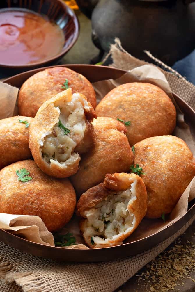 Close-up shot of bread roll served in copper plate