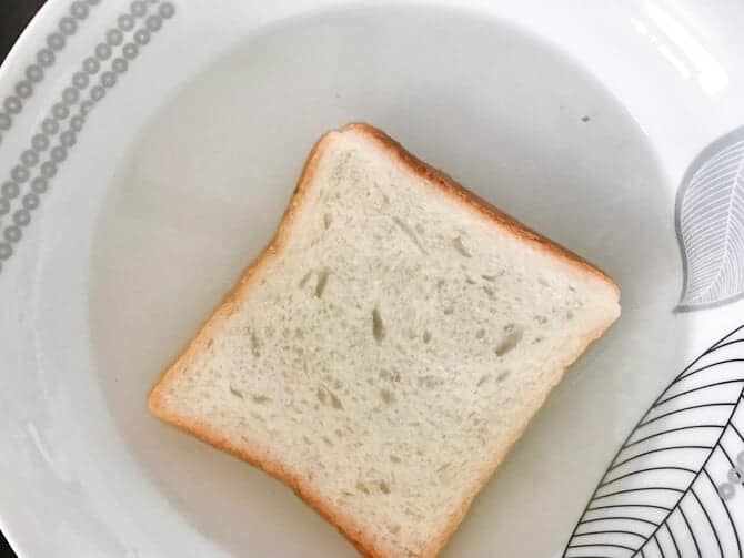 white bread slice dipped in water