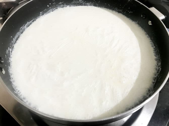 Milk boiling in pan for the making of rabdi recipe.