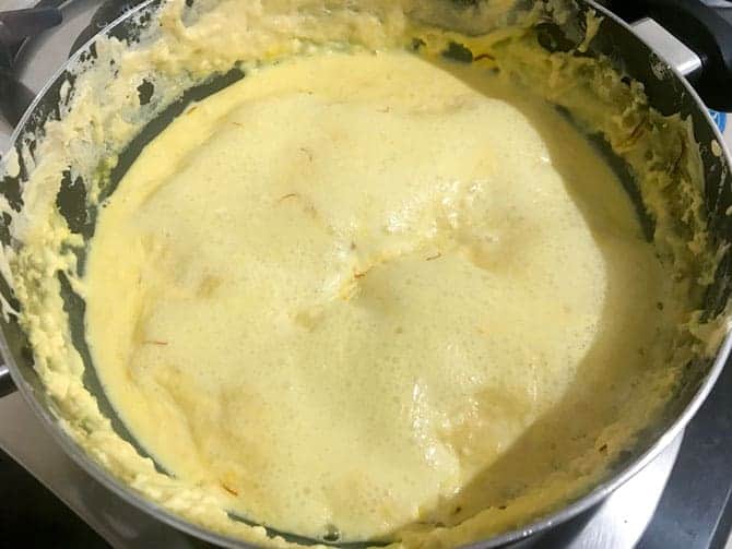 Kesar rabri further simmering in pan.