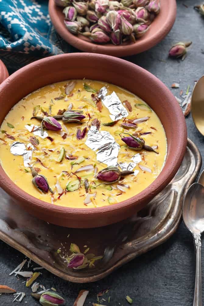 Close up shot of kesar Rabdi or sweetened condensed milk served in earthen pot.