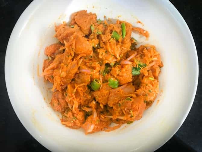 Chicken pakora mixture in bowl ready to fry.