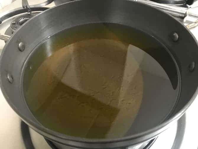Oil heating in deep pan.