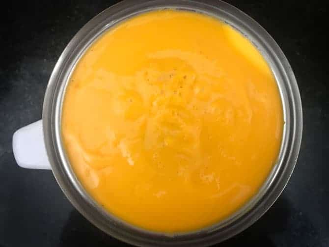 Blended mango lassi in a jar.