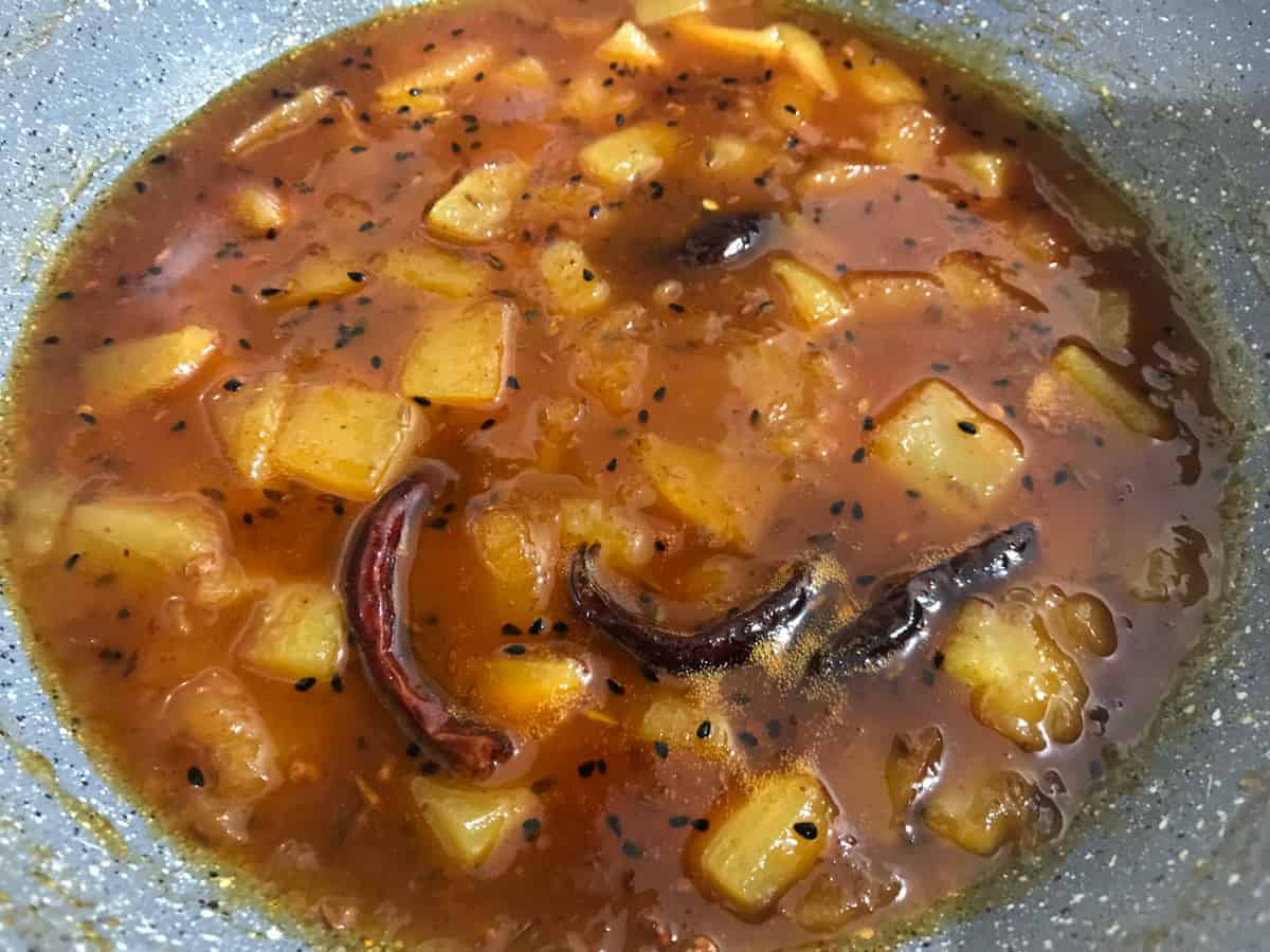 Cooked Aam Ki Launji ready in pan.