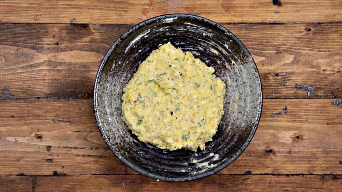 Corn cheese balls mixture in bowl.