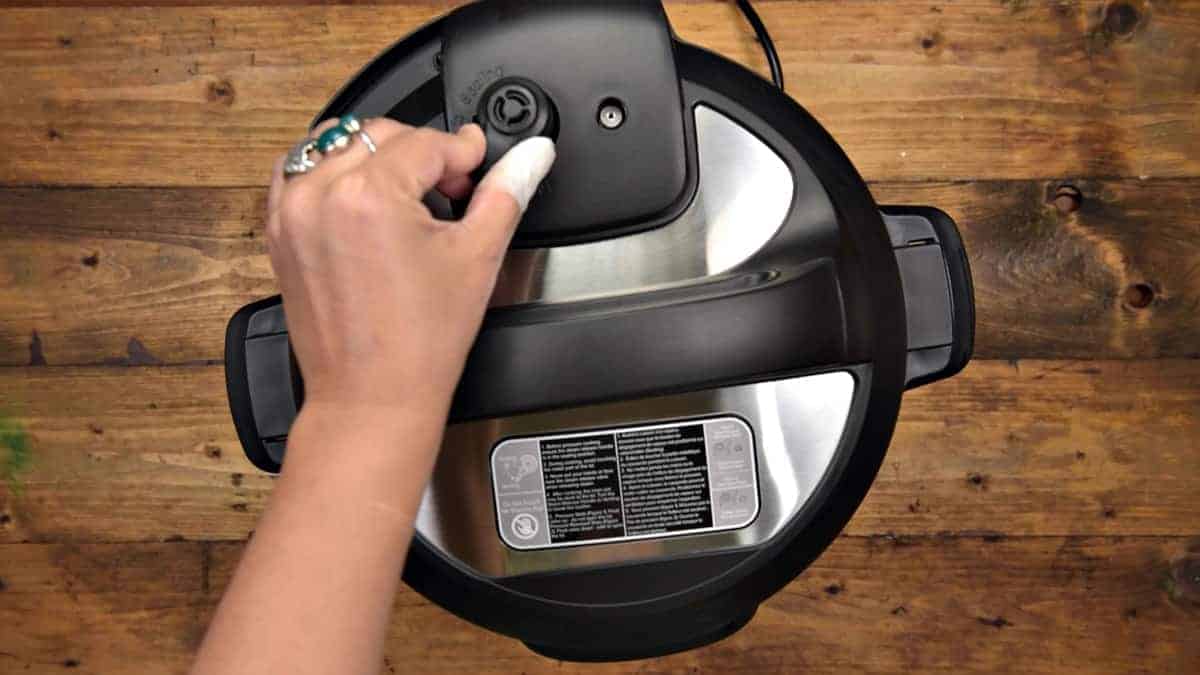 Manually quick releasing the Instant Pot.