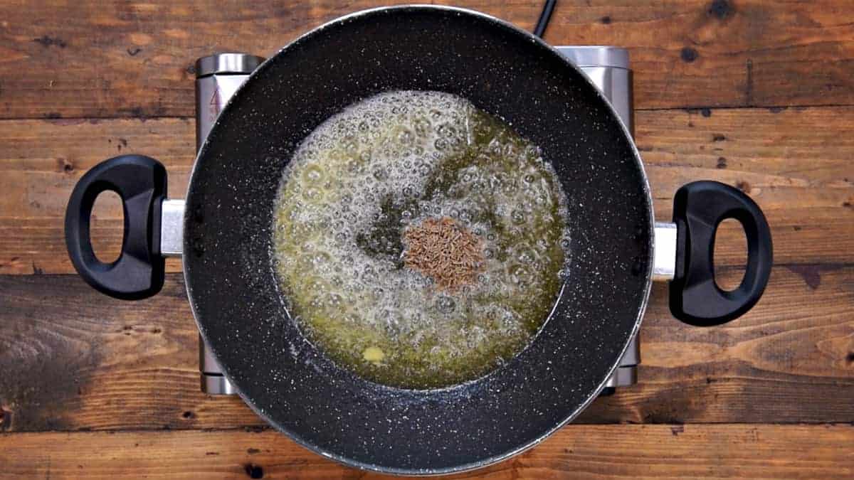 Cumin seeds added in pan.