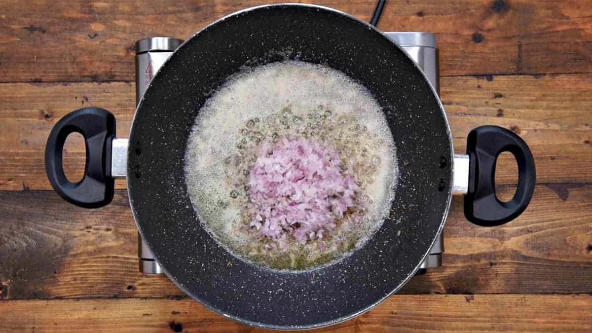 Finely chopped onion added in pan.