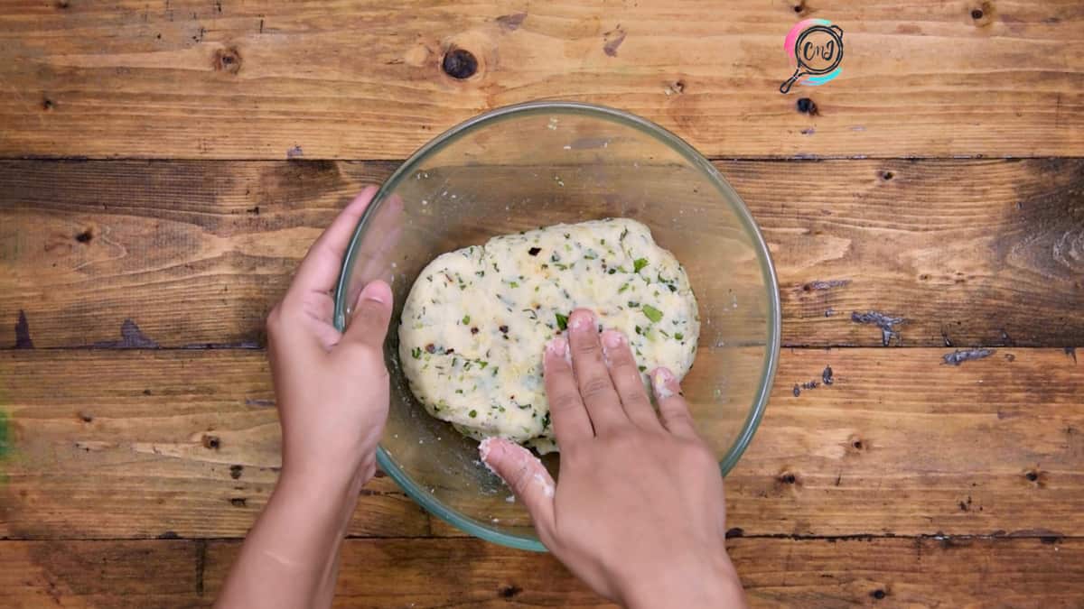 Potato mixture in glass bowl ready to shape into tikki or patties.