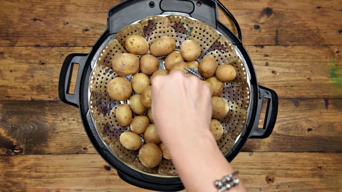 Taking out the boiled potatoes from the Instant Pot.