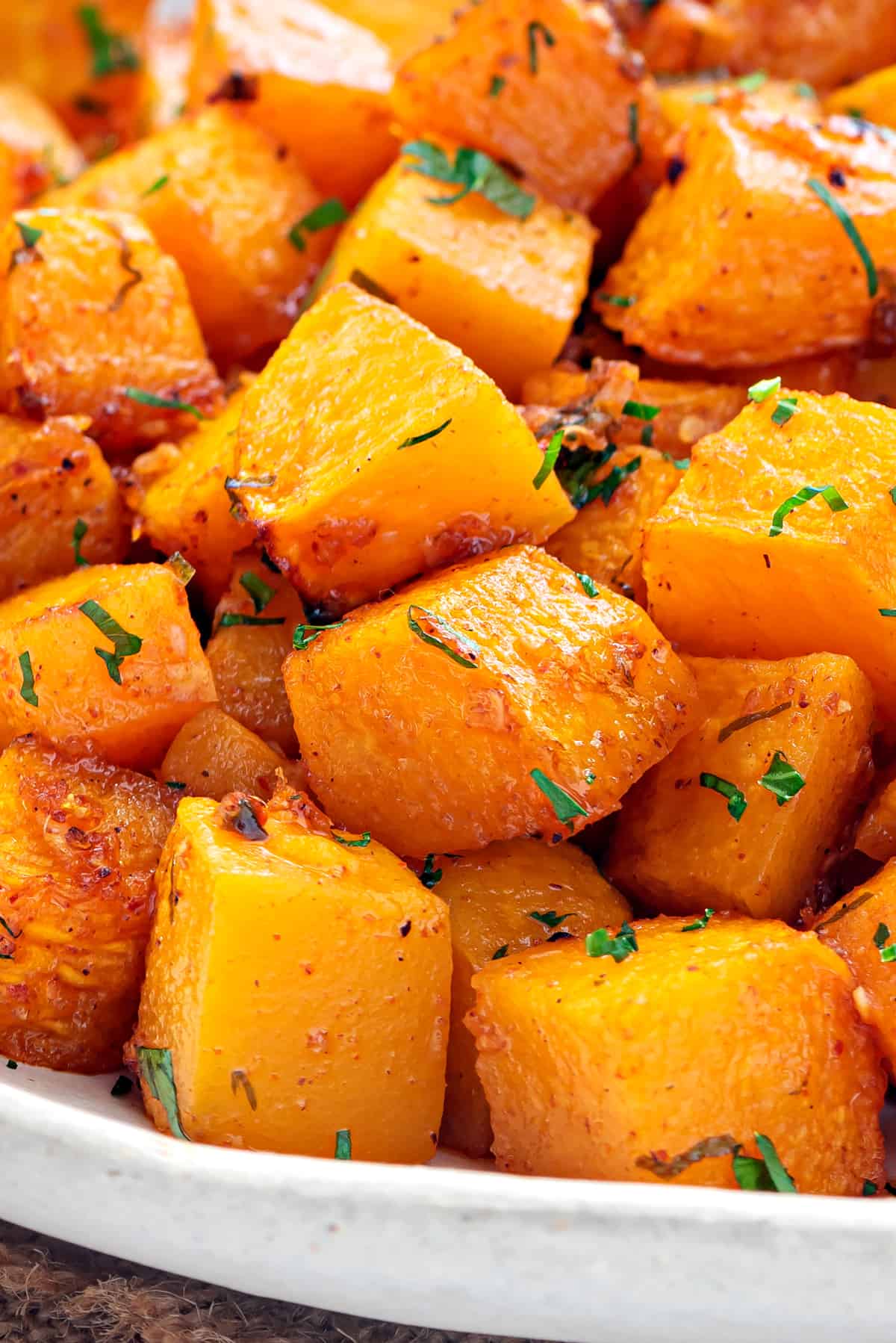 Closeup of butternut squash cubes roast.