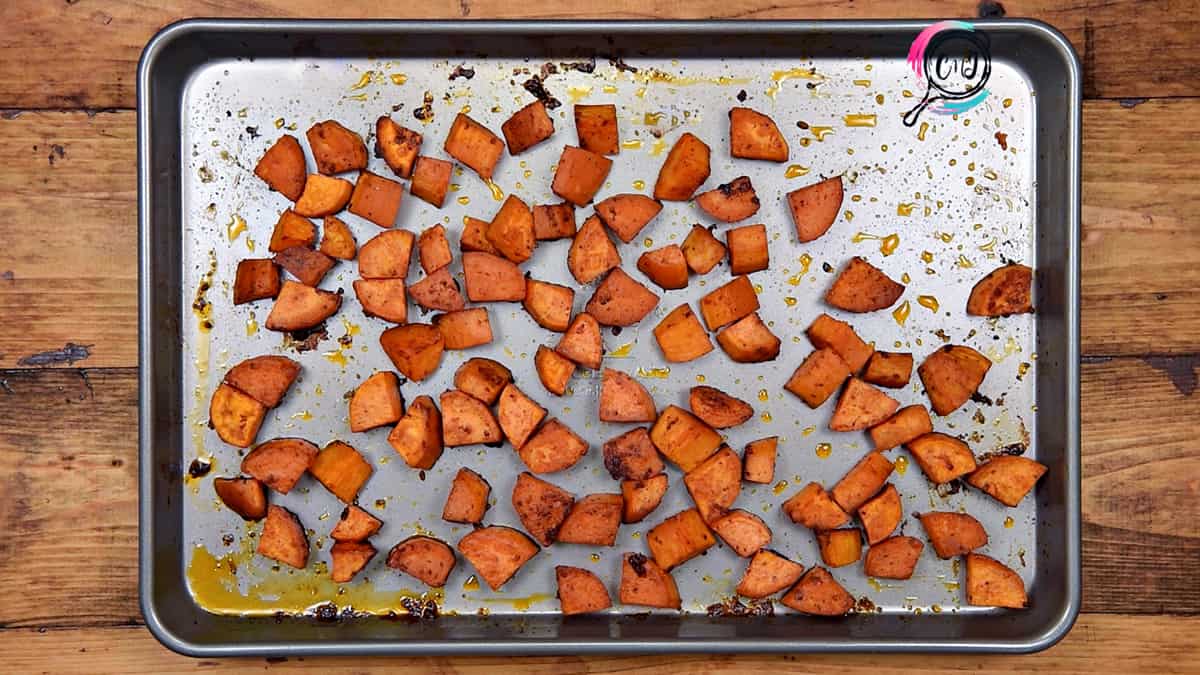Roasted sweet potatoes on baking sheet pan ready to serve.