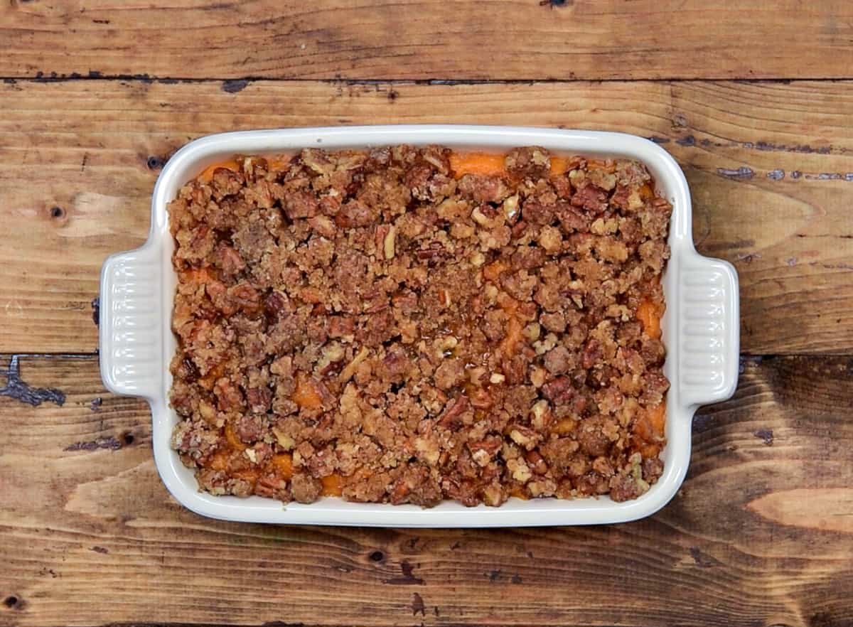 Pecan streusel topped on half baked sweet potato casserole.