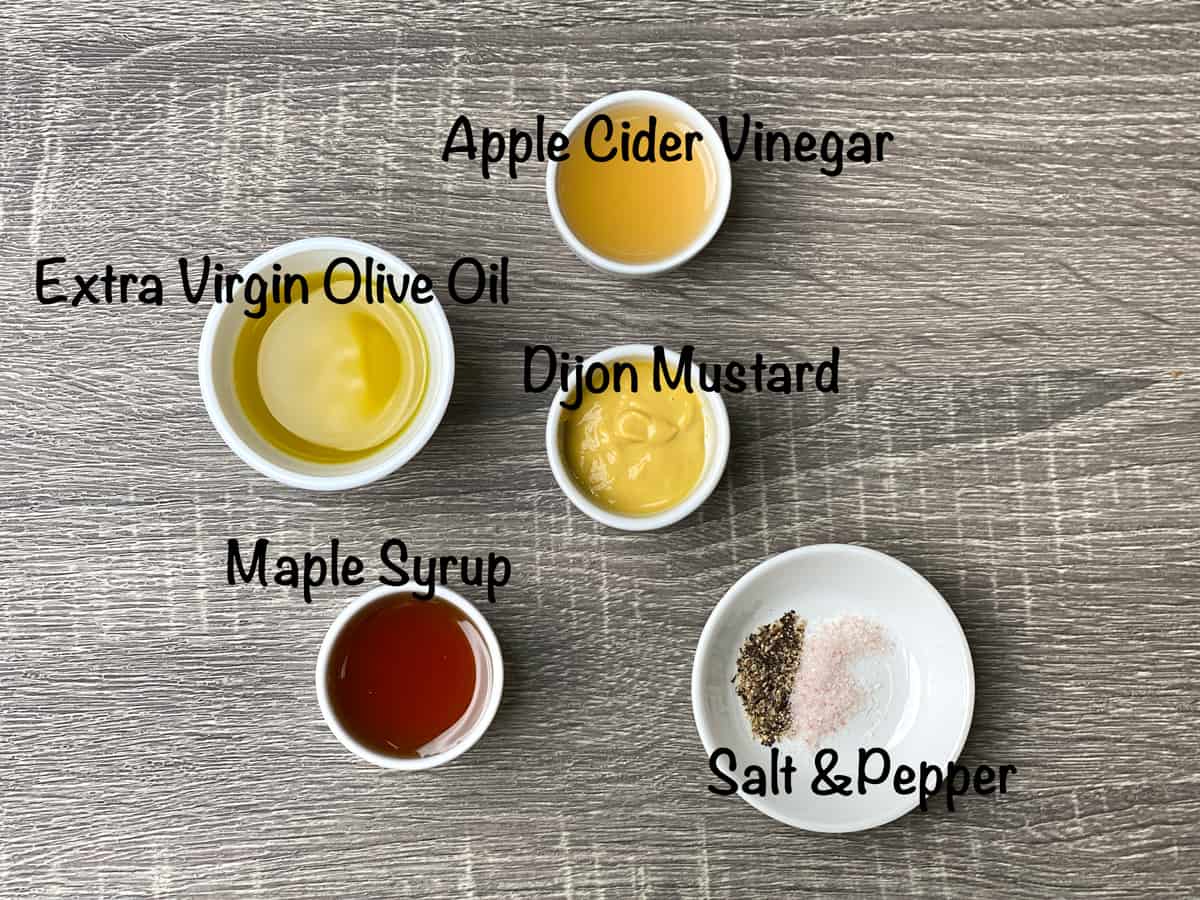 mise en place for apple cider vinaigrette placed in small white bowls