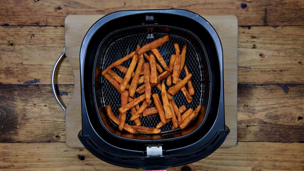sweet potato fries in basket after cooking in the air fryer