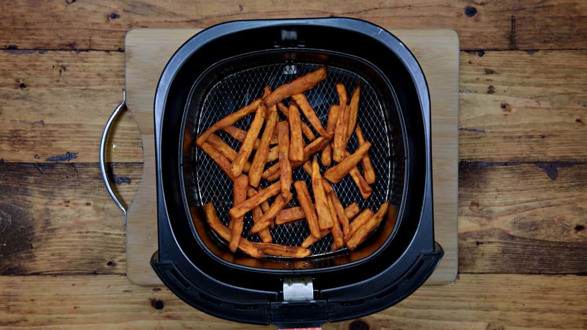 sweet potato fries in basket after cooking in the air fryer