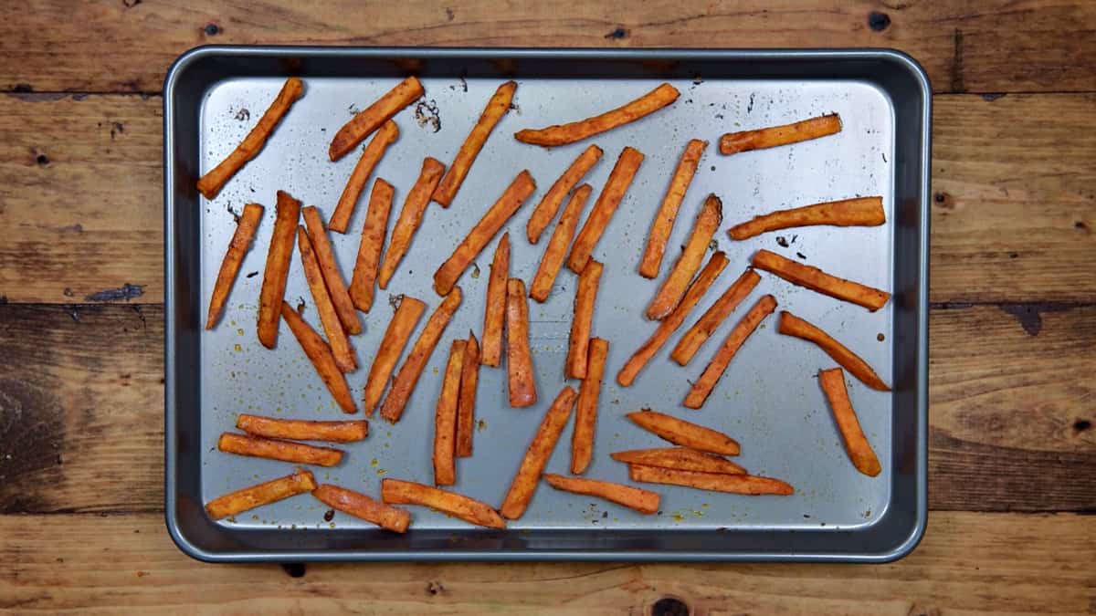oven baked sweet potato fries on a sheet pan