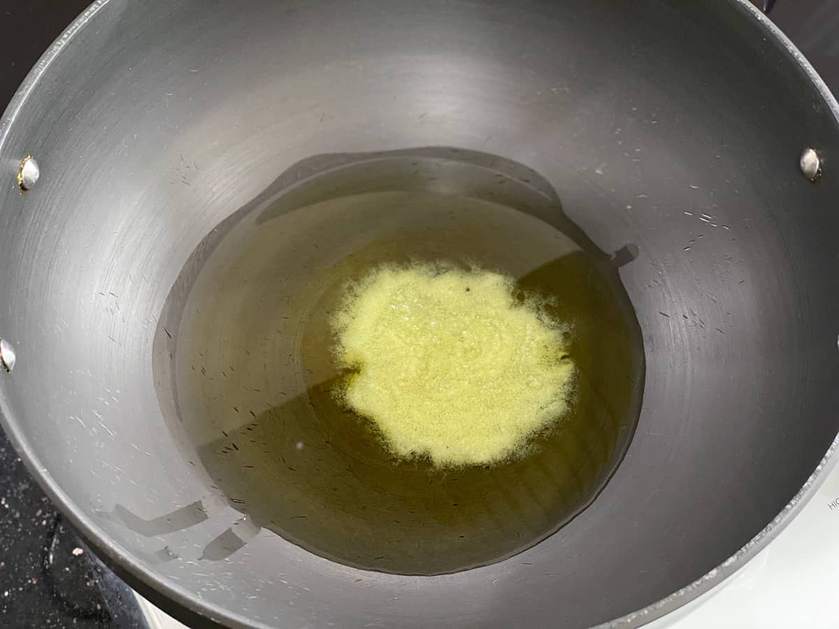 ghee and oil heating in a wok