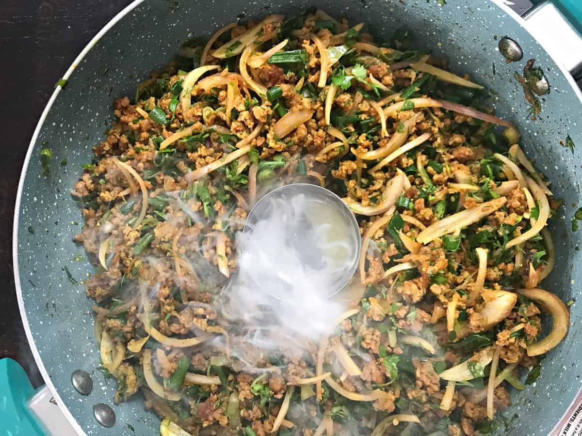 ghee added to charcoal in dish to smoke the keema meat filling