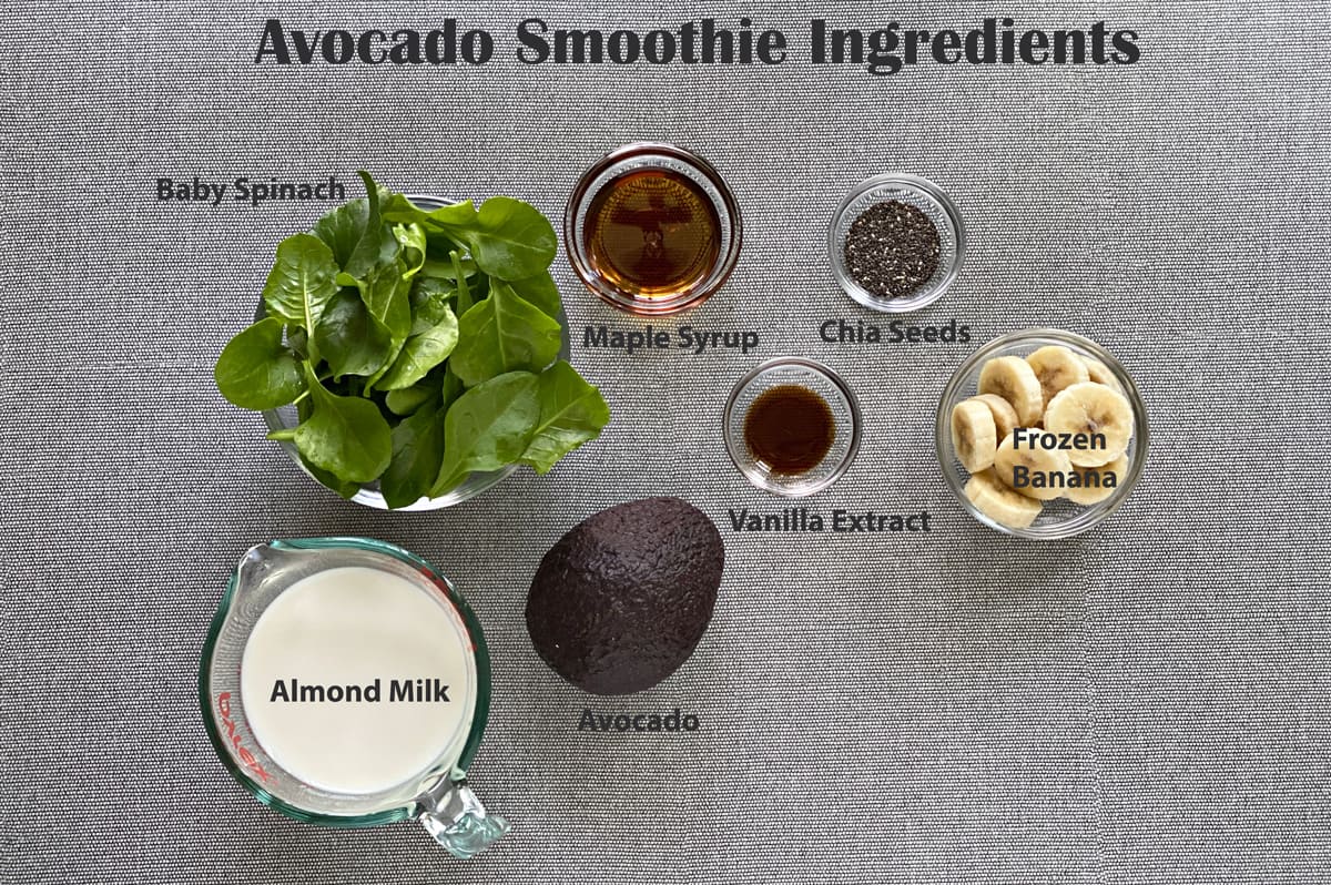 ingredients to make spinach avocado smoothie - spinach, maple syrup, chia seeds, frozen bananas, vanilla extract, avocado and almond milk