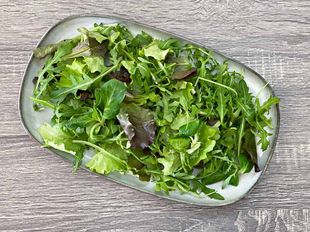 salad greens on a serving tray