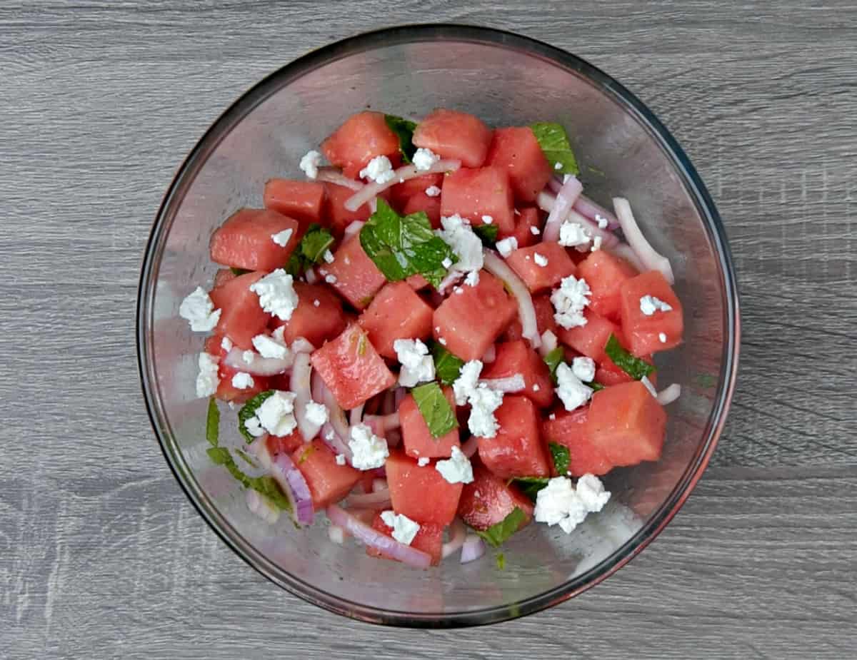 completed watermelon feta salad in mixing bowl