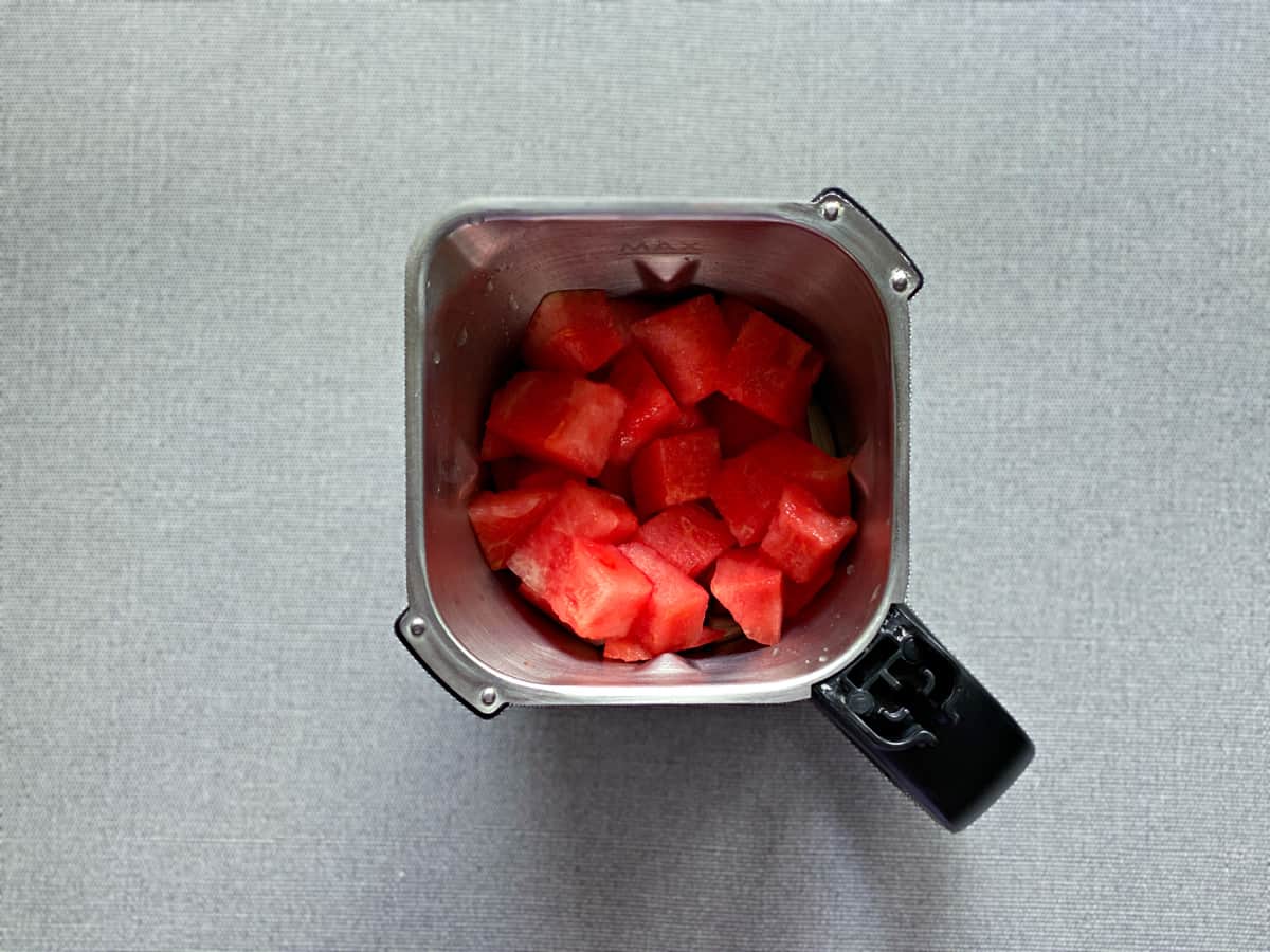 cubed watermelon in the pitcher of a blender