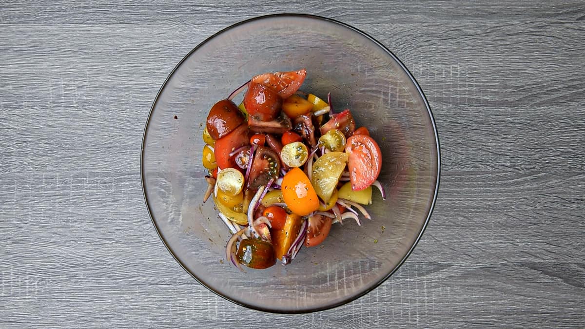 tomatoes, onions and dressing tossed together