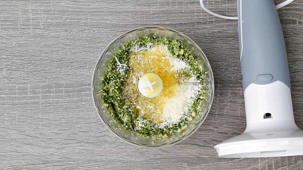 grated parmesan and olive oil added to the chopper bowl