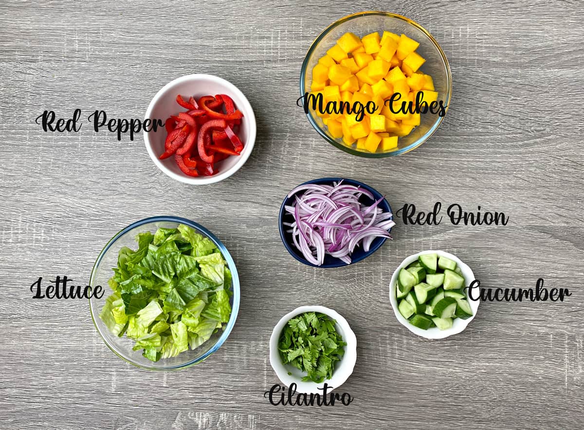 produce needed for mango salad recipe laid out on a table