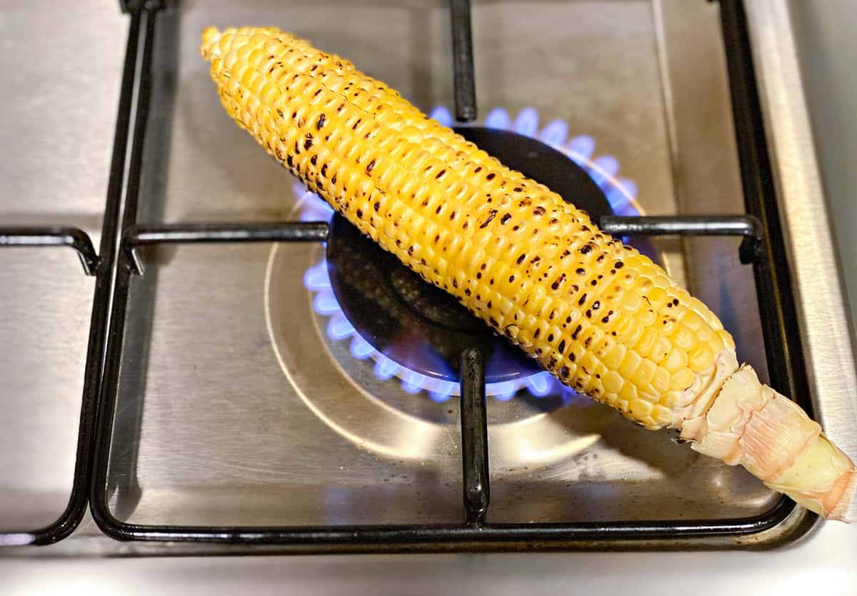 grilling the corn on stovetop for salad