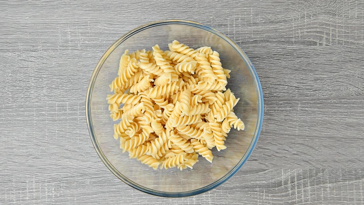 boiled and drained fusilli in a clear glass bowl