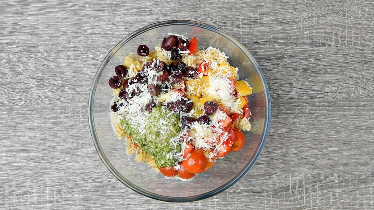 remaining pasta salad ingredients added to bowl with fusilli