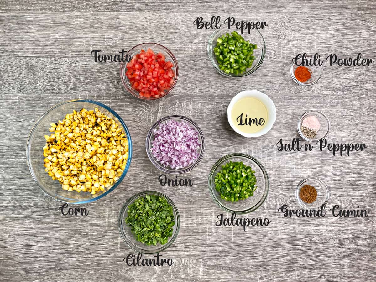 ingredients for making fresh corn salsa measured out into bowls