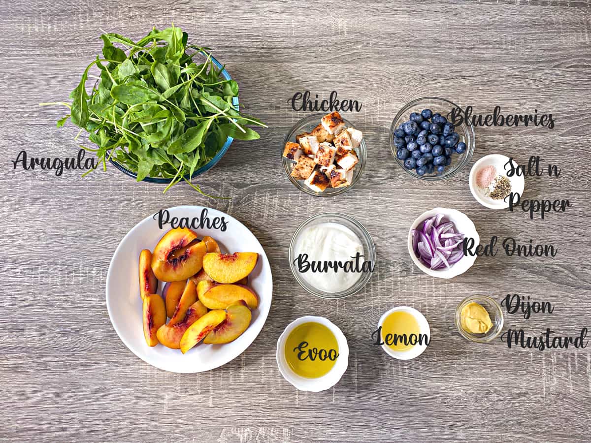 ingredients for making peach salad measured out into bowls on a table