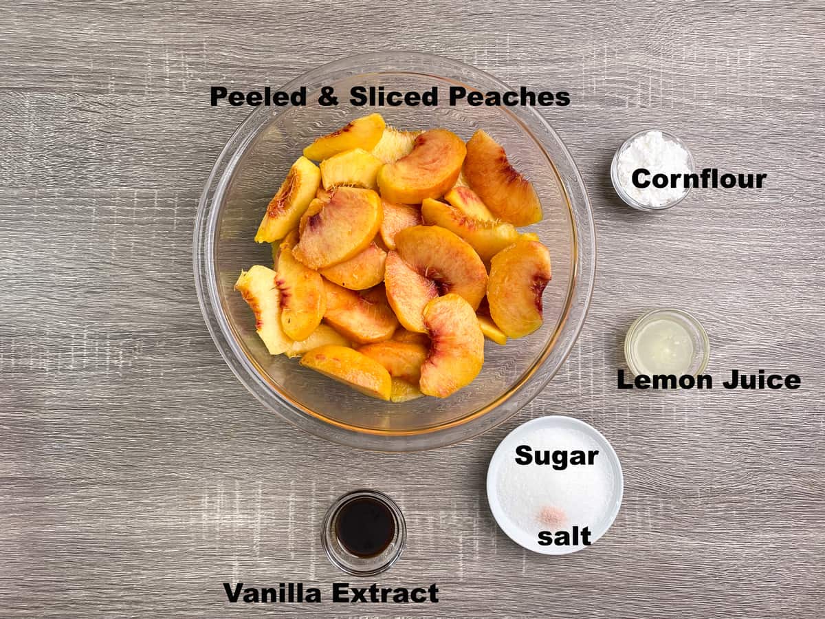 ingredients for peach crisp filling measured out into bowls